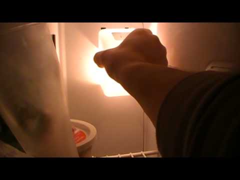 how to remove the light cover on a g.e. refrigerator