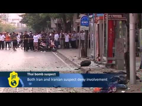 Thai Police escort Iranian Suspect Mohammad Harzei to sites used in the Bangkok Bomb Attacks