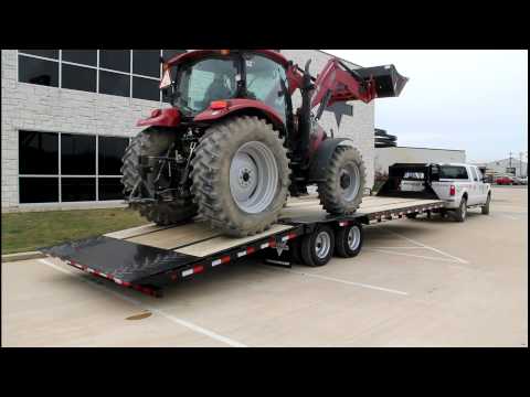 Gooseneck - Demo of a PJ 32 ft Low Profile Hydraulic Dovetail loading a Case IH Maxxum 115 tractor. This is the NUMBER ONE selling gooseneck hydraulic dovetail trailer i...