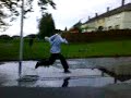 lee running throught a puddle