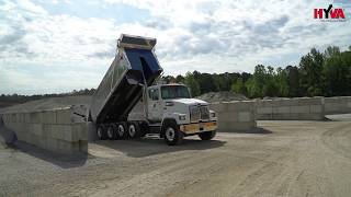 Western Star truck transport in Highland Paving - Godwin dump truck with HYVA
