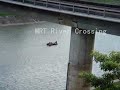 Workmen on Motor Boat picking up Debris from River