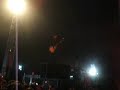 Nic Cester from Jet plays on top of a speaker