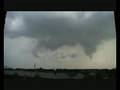 Passing thunderstorm showing weak rotation