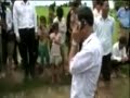 Sam Rainsy helping Cambodian farmers
