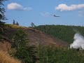 Czarnek 868 m npm - Dogaszanie pożaru/pogorzeliska z powietrza przez samoloty rolnicze PZL M18 Dromader.Widok ze pd zboczy Włostowej (903 m npm) z drogi na wysokosci 770 m npm.W pobliżu: schr. PTTK Andrzejówka - Przeł. Trzech Dolin (810 m npm), Sokołowsko (540-590 m npm)