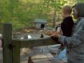 Sesyra Feeding Chickens