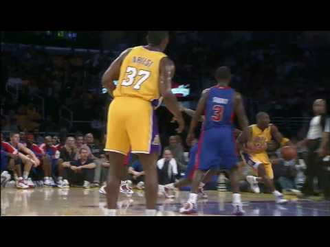 Kobe Bryant drives, spins, and somehow gets his no-look shot to fall.