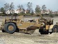 CAT 657E scrapers in up close action