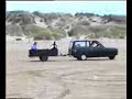 southport ainsdale beach. wife driving the plastic pig with