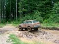 75 jeep wagoneer on 37's playing in mud hole
