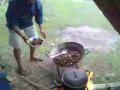 some local people in philippines eating a dog