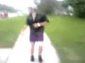 brad veldman walkin down the street in a skirt.
