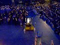 thousands of people singing the salve regina at the end of the daily torchlight rosary procession in lourdes, france
