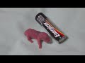 gerbil baby next to a battery gerbil baby next to a battery