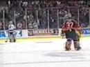 Scott Niedermayer hits Peter Worrell with his stick