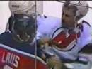 Scott Niedermayer hits Peter Worrell with his stick