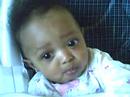 Kamari in her highchair