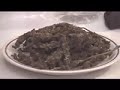 this a video of the ceremonial chalice pipe, mostly used by rastas in their spiritual gatherings.  however, in this case, this individual is sending a video message to his brothers and sisters abroad.