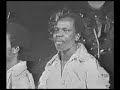 franco in 1975 playing his guitar in his own style of several years before. a one-off, never recorded, so wuta mayi, josky kiambukuta and youlou mabiala had to read the lyrics off a note. not to be judged without some understanding of the historical context. mobutu regularly made franco 