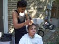 Egytian getting a haircut
