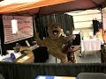 A teddy bear furry waits for a massage chair at the pittsburgh rv show