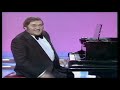 Les Dawson, playing the piano
