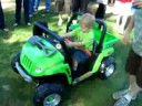 Kayleb riding his power wheels