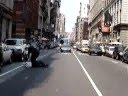 A New York police officer forced to chase a street vendor.
