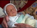Grandma Tries to get baby Samuel to do the \"smile-ees\"