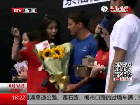 bejing - Michael Owen talks to a Chinese News Station on his arrival in Bejing for his 4 day tour sponsored by SoccerWorld Note: Audio in Chinese apart from Michael O...