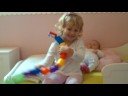 Isabella playing with pop beads