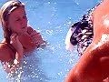 jono pushing janine in pool on holiday