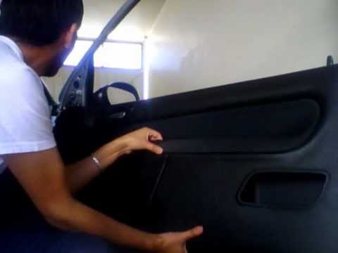 Quitar panel puerta peugeot 206.wmv