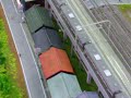 311系　セントラルタワーズ横を通過