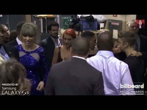 Taylor Swift sticks her tongue out to Selena and Justin Bieber's romance.