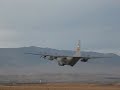 C-130 Hercules taking off, shooting flares