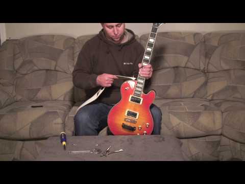 how to attach the strap to a guitar