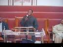 Pastor Gary Bush singing \"You alone are God.\"