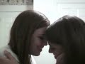 Sisters practising kissing