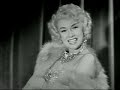 Edie Adams classic 1950s portrayal of Marilyn Monroe as seen on the Ernie Kovacs program.