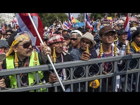 minister - Thailand's prime minister dissolves parliament but street unrest continues Subscribe to the Guardian HERE: http://bitly.com/UvkFpD Thailand's prime minister ...