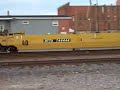 CNW 8701 leads train MPRCB-27 through Sterling, IL with UP 9087 trailing. Sorry about the camera shaking, my hands were froze and it was windy.