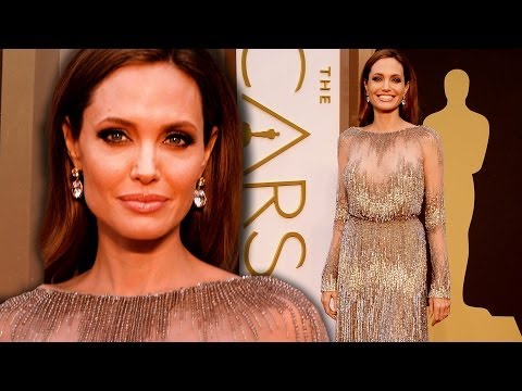 Red Carpet - Oscars arrivals gallery: http://bit.ly/1kpO5rq http://bit.ly/SubClevverStyle - Subscribe to ClevverStyle! Angelina Jolie shined in a metallic and sheer gown ...