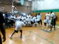 Josh Powell and Dwight Howard with the broom and the kids at the basketball camp