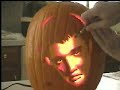 Carving Elvis into a pumpkin