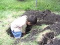 Barefoot 3yo Luc climbs out hole Barefoot 3yo Luc climbs out hole