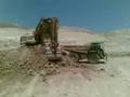 liebherr 994 loading cat 777F
