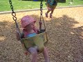 Charlotte on a swing