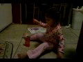Sarah singing on the kitchen floor 11-30-09.